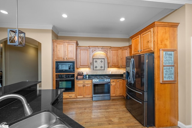 204 Whitworth Way, Simpsonville, SC 29681 - kitchen featuring black appliances, arched walkways, crown molding, light wood-style flooring, and recessed lighting