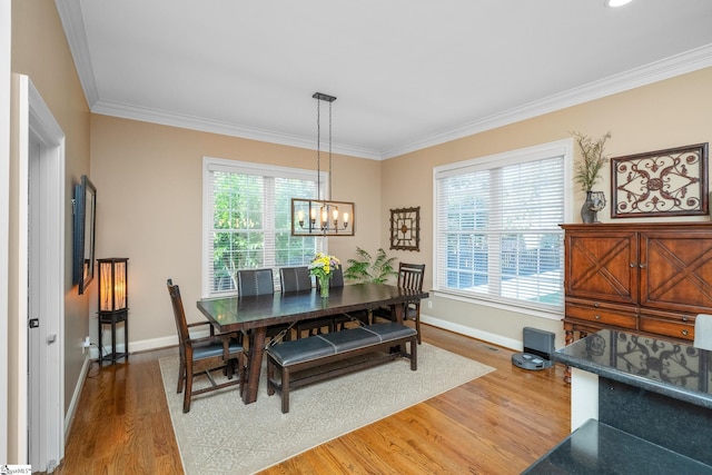 204 Whitworth Way, Simpsonville, SC 29681 - dining area with wood finished floors, baseboards, crown molding, and a chandelier