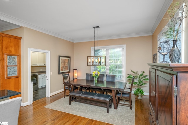 204 Whitworth Way, Simpsonville, SC 29681 - dining room with wood finished floors, a chandelier, baseboards, and ornamental molding