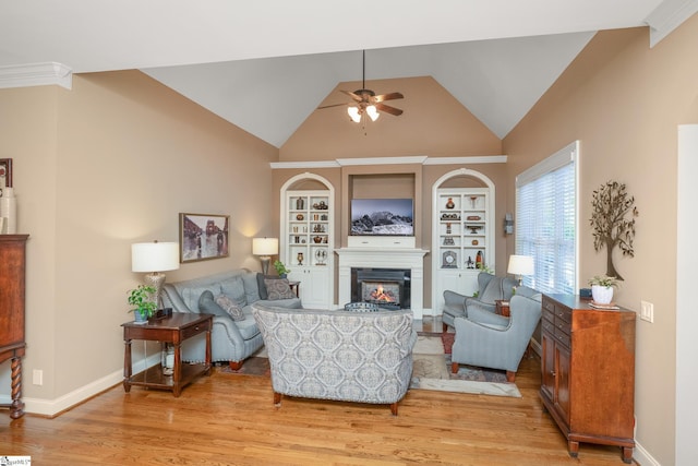 204 Whitworth Way, Simpsonville, SC 29681 - living area with ceiling fan, a glass covered fireplace, light wood-style flooring, lofted ceiling, and built in features