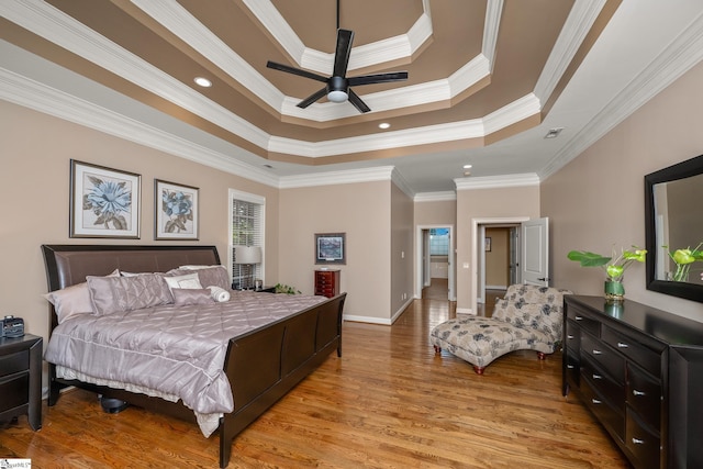 204 Whitworth Way, Simpsonville, SC 29681 - bedroom featuring crown molding, light wood-style flooring, a tray ceiling, and baseboards
