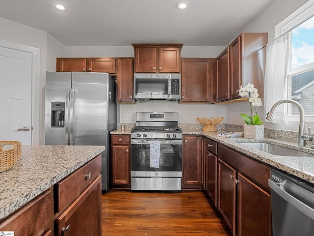 514 Olivia Springs Dr, Spartanburg, SC 29302 - kitchen featuring stainless steel appliances, a sink, dark wood-type flooring, light stone counters, and recessed lighting