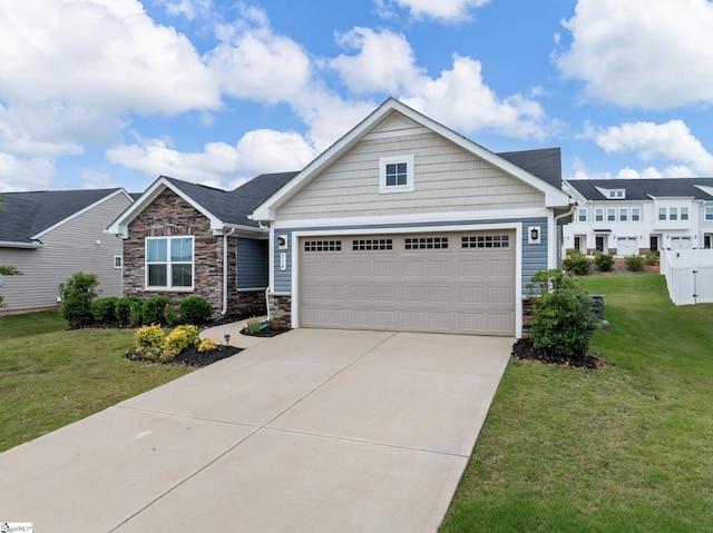 514 Olivia Springs Dr, Spartanburg, SC 29302 - craftsman-style house featuring stone siding, an attached garage, concrete driveway, and a front yard