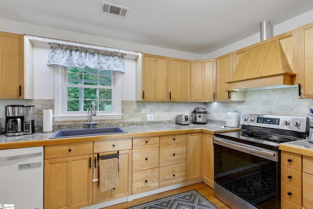 4600 Coach Hill Dr, Greenville, SC 29615 - kitchen featuring stainless steel electric range oven, dishwasher, a sink, light brown cabinets, and custom exhaust hood