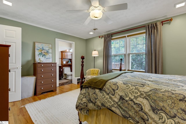4600 Coach Hill Dr, Greenville, SC 29615 - bedroom with light wood-style flooring, crown molding, ceiling fan, and ensuite bathroom