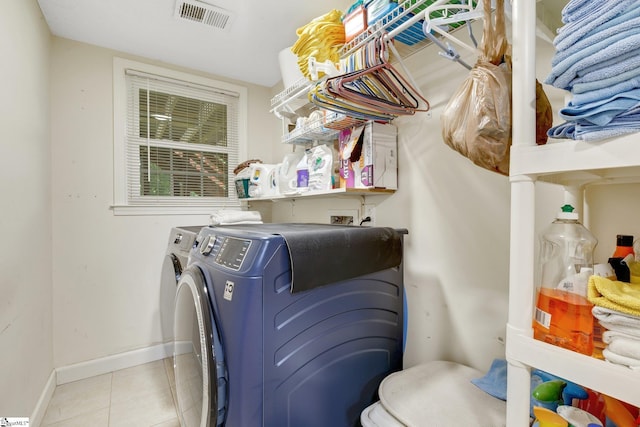 4600 Coach Hill Dr, Greenville, SC 29615 - laundry area with washing machine and clothes dryer, tile patterned floors, and baseboards