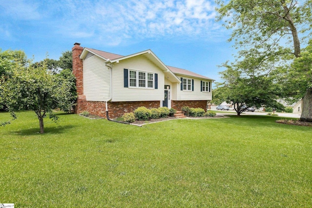 4600 Coach Hill Dr, Greenville, SC 29615 - split foyer home featuring brick siding, a chimney, and a front lawn