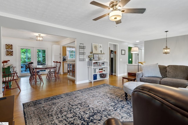 4600 Coach Hill Dr, Greenville, SC 29615 - living room featuring healthy amount of natural light, ceiling fan, wood finished floors, baseboards, and ornamental molding