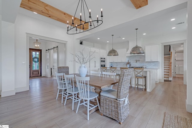 320 Terry Rd, Fountain Inn, SC 29644 - dining area with light wood-style flooring, a chandelier, recessed lighting, and washer / dryer