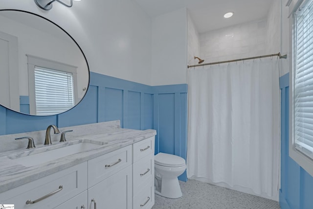 320 Terry Rd, Fountain Inn, SC 29644 - bathroom with toilet, healthy amount of natural light, a wainscoted wall, vanity, and curtained shower