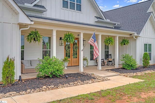 320 Terry Rd, Fountain Inn, SC 29644 - view of exterior entry with board and batten siding, a porch, and a shingled roof