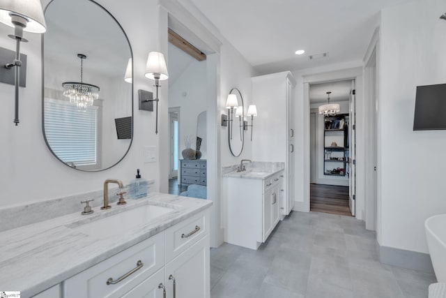 320 Terry Rd, Fountain Inn, SC 29644 - full bath with a chandelier, two vanities, recessed lighting, a spacious closet, and a freestanding bath