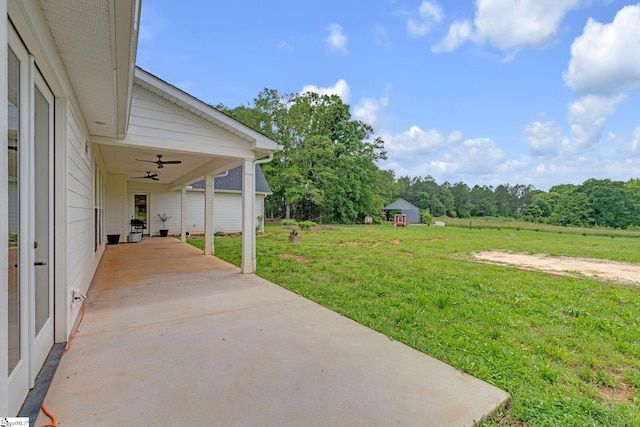 320 Terry Rd, Fountain Inn, SC 29644 - view of grassy yard with a ceiling fan, an attached carport, and a patio
