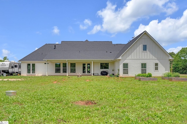 320 Terry Rd, Fountain Inn, SC 29644 - rear view of property with french doors, board and batten siding, a yard, and a garden