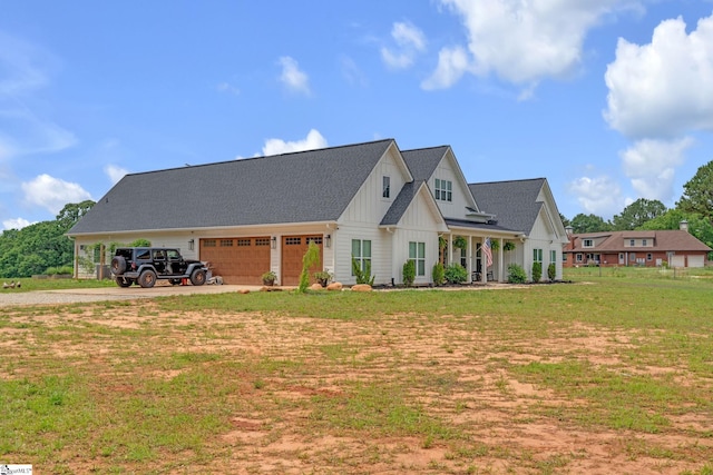 320 Terry Rd, Fountain Inn, SC 29644 - modern inspired farmhouse featuring board and batten siding, driveway, a front lawn, and an attached garage