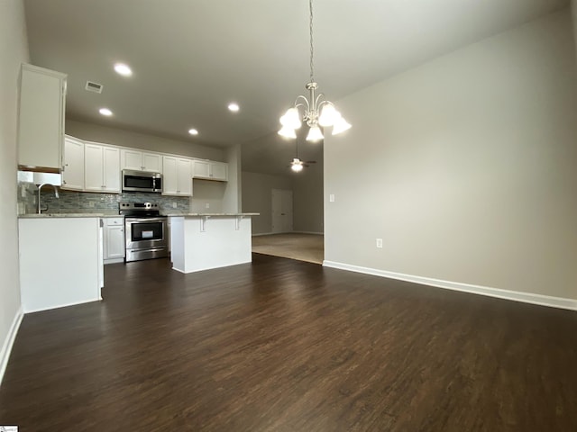 110 Patagonia Rd, Anderson, SC 29625 - kitchen with appliances with stainless steel finishes, a chandelier, open floor plan, tasteful backsplash, and recessed lighting