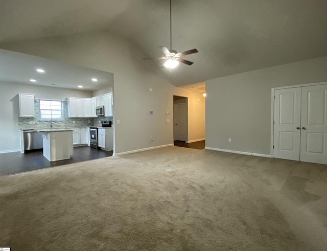 110 Patagonia Rd, Anderson, SC 29625 - unfurnished living room featuring a ceiling fan, dark carpet, baseboards, recessed lighting, and high vaulted ceiling