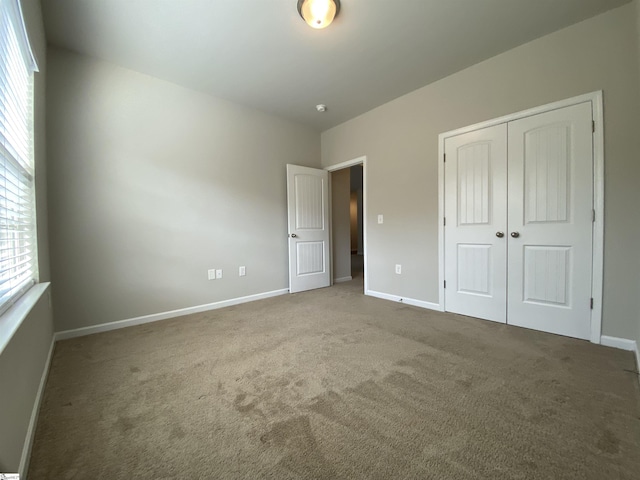 110 Patagonia Rd, Anderson, SC 29625 - unfurnished bedroom with carpet, baseboards, and a closet