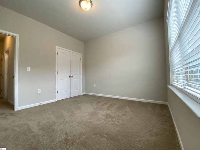 110 Patagonia Rd, Anderson, SC 29625 - unfurnished bedroom featuring carpet flooring, a closet, and baseboards