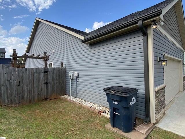 110 Patagonia Rd, Anderson, SC 29625 - view of side of home with a garage, a lawn, and a shingled roof