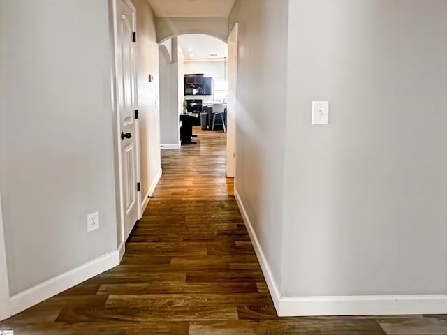 739 Shelburne Ln, Lyman, SC 29365 - corridor with arched walkways, wood finished floors, and baseboards