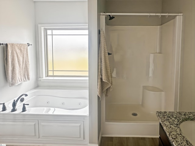 739 Shelburne Ln, Lyman, SC 29365 - bathroom with a jetted tub, a shower, wood finished floors, and vanity