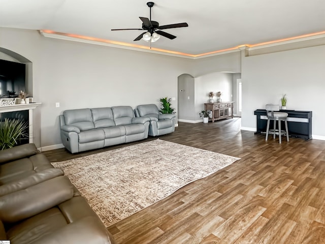 739 Shelburne Ln, Lyman, SC 29365 - living room featuring arched walkways, a ceiling fan, wood finished floors, and baseboards