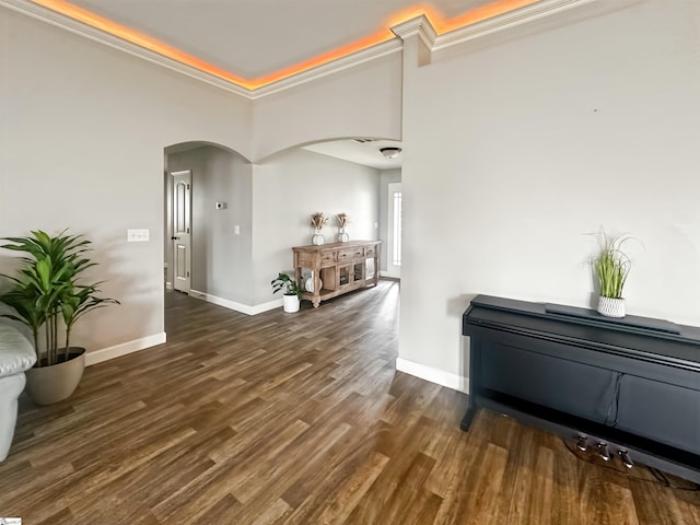 739 Shelburne Ln, Lyman, SC 29365 - hallway featuring arched walkways, baseboards, wood finished floors, ornamental molding, and a towering ceiling