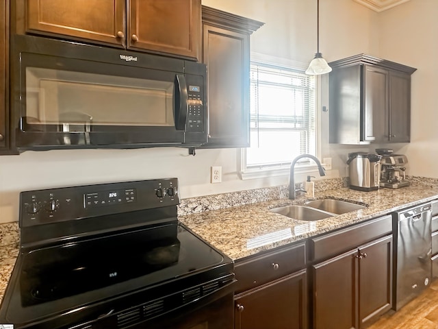 739 Shelburne Ln, Lyman, SC 29365 - kitchen with black appliances, a sink, light stone countertops, and pendant lighting