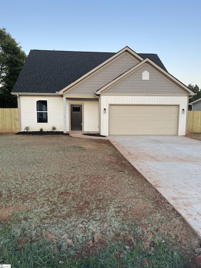 102 Turkey Trot Rd, Williamston, SC 29697 - view of front of home featuring an attached garage, driveway, and a shingled roof