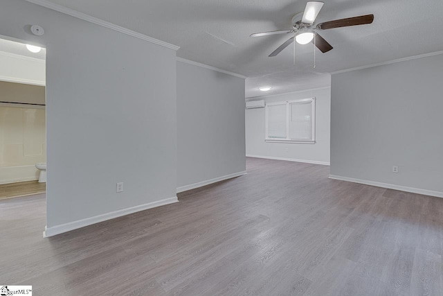 1709 Lyndon Ave, Anderson, SC 29624 - spare room with ceiling fan, ornamental molding, wood finished floors, a wall mounted air conditioner, and baseboards