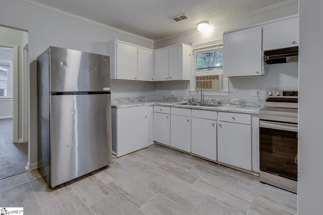 1709 Lyndon Ave, Anderson, SC 29624 - kitchen featuring appliances with stainless steel finishes, a sink, under cabinet range hood, ornamental molding, and light countertops