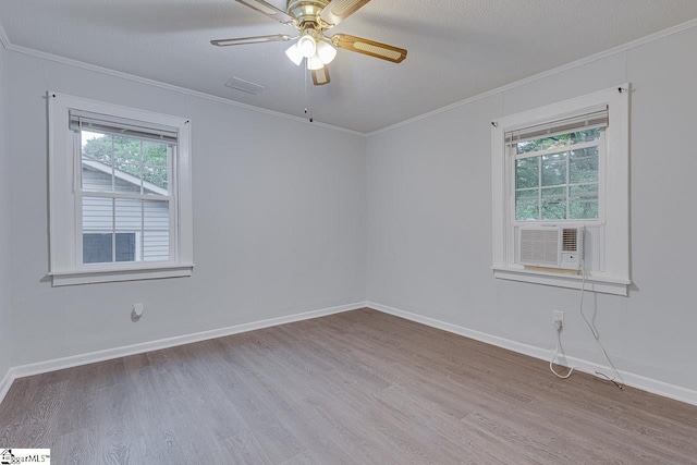 1709 Lyndon Ave, Anderson, SC 29624 - spare room featuring healthy amount of natural light, ornamental molding, wood finished floors, baseboards, and a ceiling fan