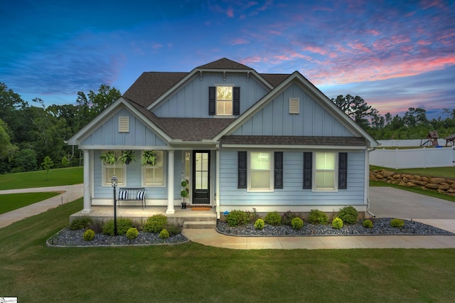 226 Deerview Trl, Simpsonville, SC 29680 - view of front of home featuring a porch, a shingled roof, a front yard, and board and batten siding