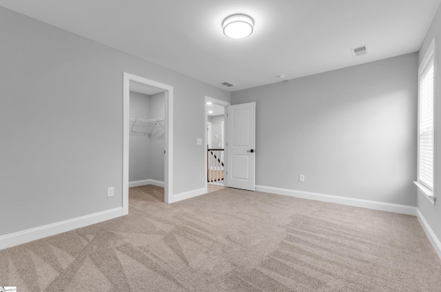 226 Deerview Trl, Simpsonville, SC 29680 - unfurnished bedroom featuring carpet floors, a spacious closet, baseboards, and multiple windows