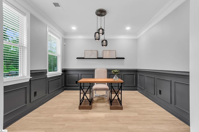 226 Deerview Trl, Simpsonville, SC 29680 - dining area featuring crown molding, wainscoting, light wood-style flooring, a decorative wall, and recessed lighting