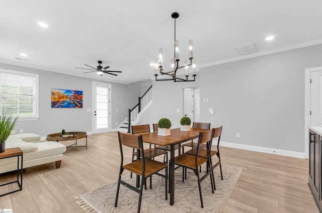 226 Deerview Trl, Simpsonville, SC 29680 - dining area featuring a ceiling fan, a chandelier, light wood-style flooring, stairs, and recessed lighting