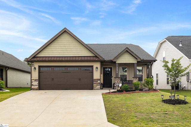 2606 Karkinnen Way, Moore, SC 29369 - craftsman inspired home featuring stone siding, a porch, driveway, and a front lawn