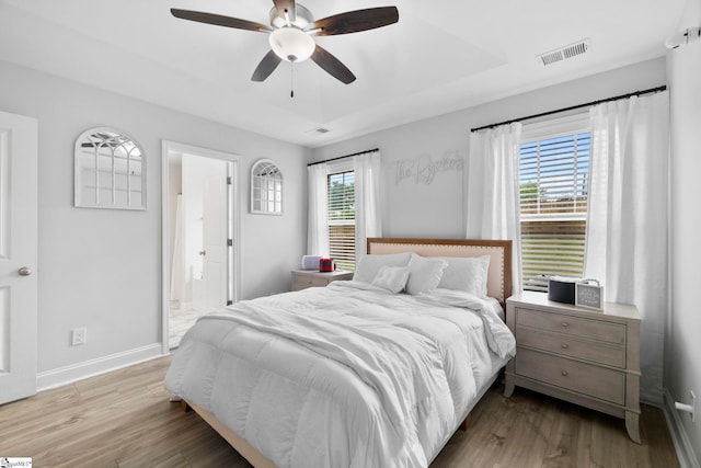 2606 Karkinnen Way, Moore, SC 29369 - bedroom featuring baseboards, wood finished floors, ensuite bathroom, and a ceiling fan