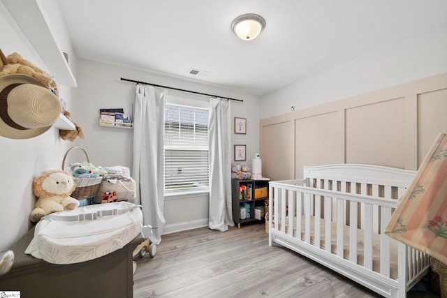 2606 Karkinnen Way, Moore, SC 29369 - bedroom featuring light wood-style floors and baseboards