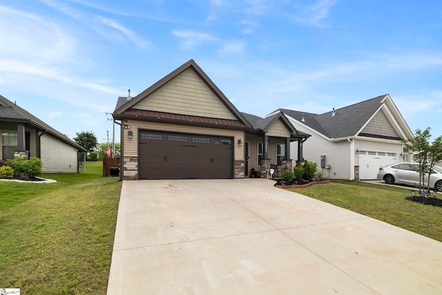 2606 Karkinnen Way, Moore, SC 29369 - view of front of home featuring a front yard, a garage, concrete driveway, and stone siding