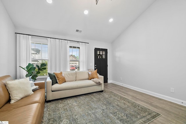 2606 Karkinnen Way, Moore, SC 29369 - living room featuring baseboards, lofted ceiling, wood finished floors, and recessed lighting