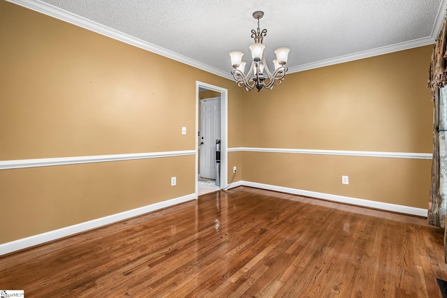 103 Farming Creek Dr, Simpsonville, SC 29680 - spare room with crown molding, a textured ceiling, a chandelier, wood finished floors, and baseboards