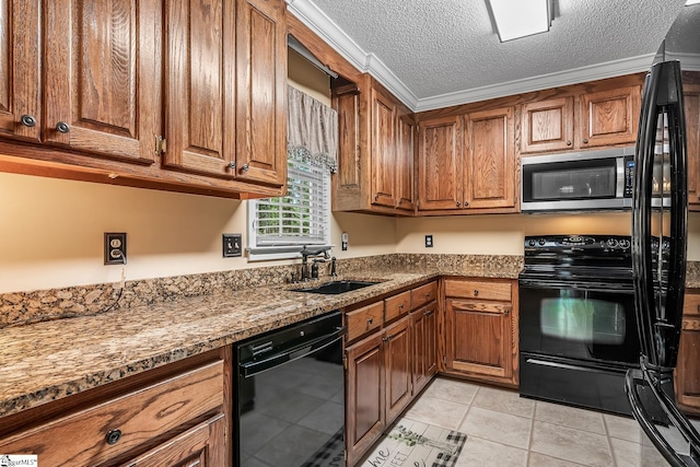 103 Farming Creek Dr, Simpsonville, SC 29680 - kitchen featuring black appliances, brown cabinetry, a sink, light tile patterned flooring, and a textured ceiling