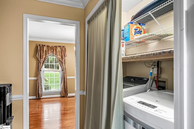 103 Farming Creek Dr, Simpsonville, SC 29680 - laundry room with crown molding, washer and dryer, wood finished floors, and baseboards