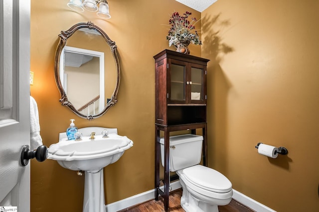 103 Farming Creek Dr, Simpsonville, SC 29680 - half bathroom with wood finished floors, toilet, and baseboards