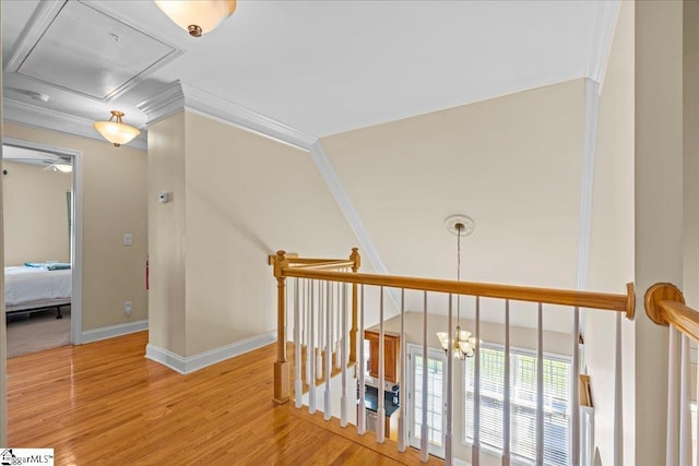449 Crepe Myrtle Dr, Greer, SC 29651 - corridor featuring crown molding, light wood-type flooring, attic access, baseboards, and an upstairs landing
