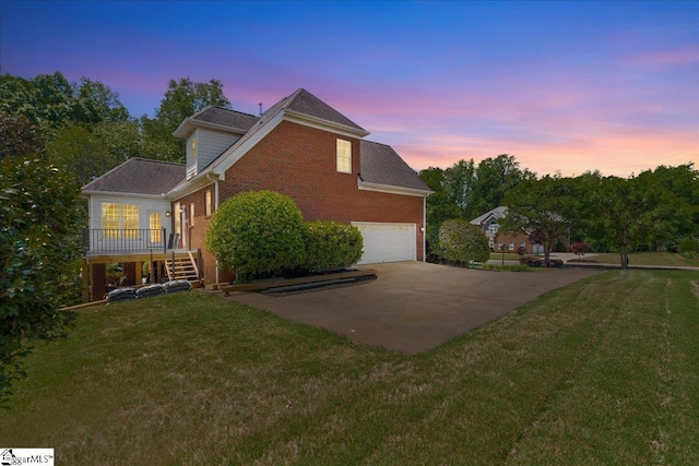 449 Crepe Myrtle Dr, Greer, SC 29651 - property exterior at dusk featuring brick siding, an attached garage, driveway, and a lawn