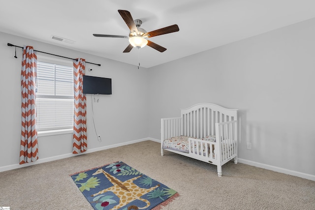 116 Bruinen Dr, Fountain Inn, SC 29644 - carpeted bedroom with baseboards, a ceiling fan, and a nursery area