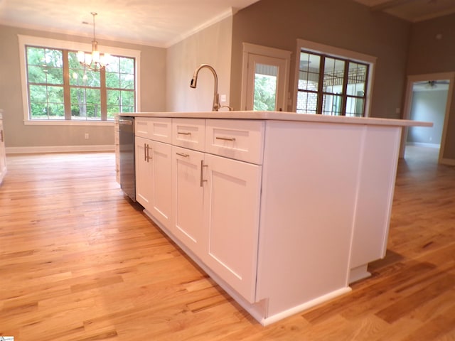 291 Robbins Rd, Chesnee, SC 29323 - kitchen with dishwasher, a chandelier, white cabinetry, light wood-style floors, and pendant lighting